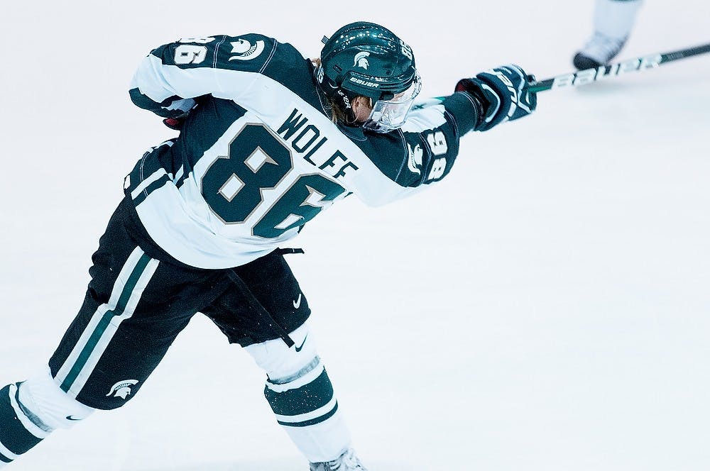 	<p>Junior right wing Greg Wolfe takes a shot against Bowling Green State on Saturday, Feb. 9, 2013, at Munn Ice Arena. Wolfe scored two of the three goals during the Spartan&#8217;s 3-1 victory. Katie Stiefel/The State News</p>