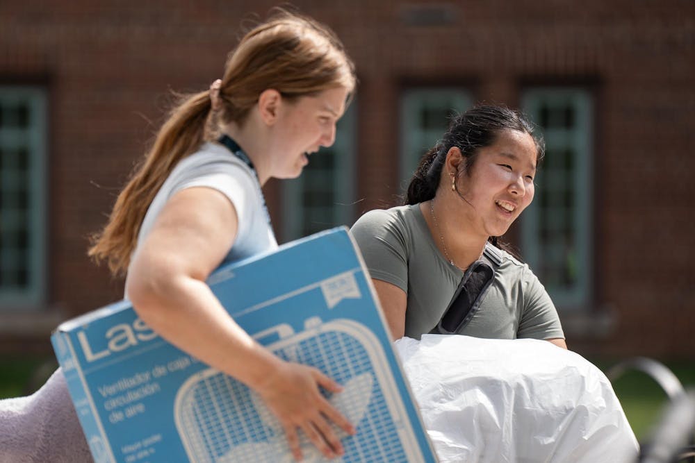 <p>An MSU student and their friend carry items to their room during fall move-in at Yakeley Hall in East Lansing, Mich., on Aug. 25, 2026.</p>