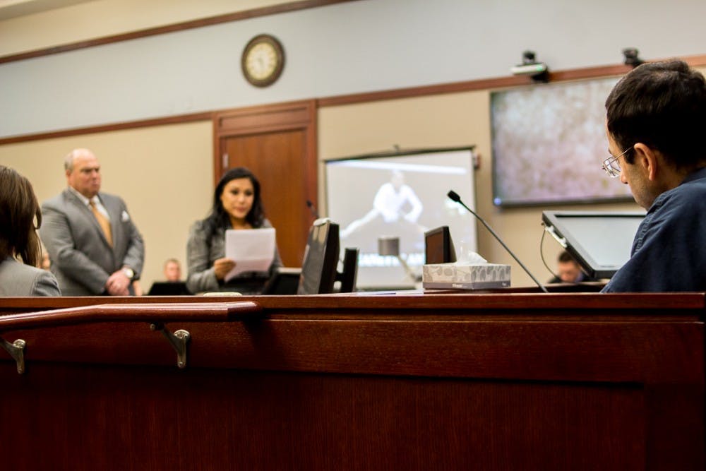 <p>Nassar listens to former gymnast Jeanette Antolin give her statement on Jan. 17, 2018, at the Veterans Memorial Court at 313 W Kalamazoo St., Lansing. Antolin was on the U.S. national team from 1995-2000.&nbsp;</p>