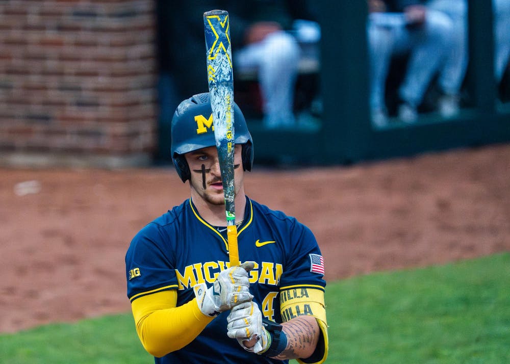 Michigan catcher Noah Miller, 4, prepares to hit during Michigan’s game against Michigan State at Jeff Ishbia Field at McLane Stadium in East Lansing, Mich., on Friday, April 10, 2026.