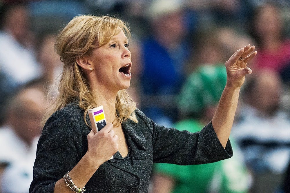 Head coach Suzy Merchant yells to her team during the third round of the Big Ten Tournament against Penn State on March, 9, 2013, at Sears Centre in Hoffman Estates, Ill.  The Spartans will play Purdue for the Big Ten Tournament trophy March 10, 2013. Julia Nagy/The State News 