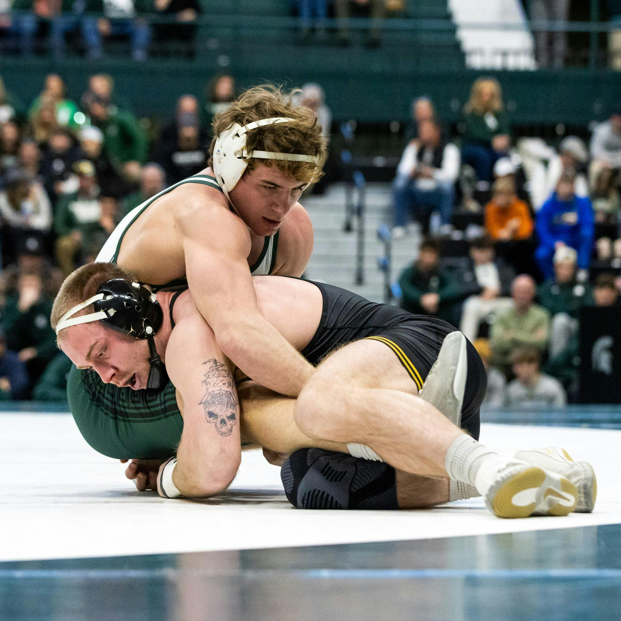 MSU Gr. Wt. 174, Connor O'Neill, holds down his Iowa opponent in the Jenison Field House in East Lansing, MI on Feb. 8, 2026.