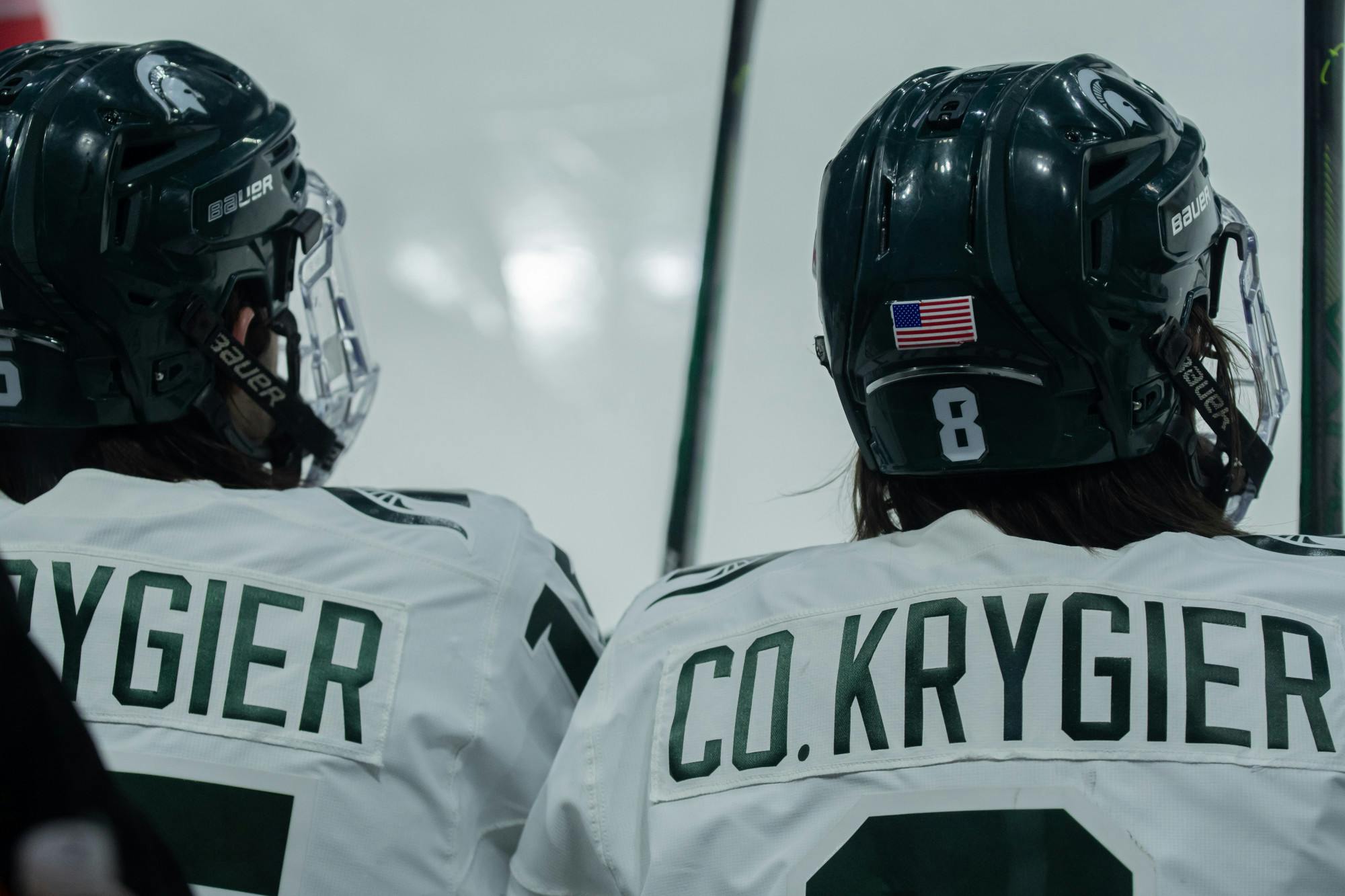 Junior defensemen Cole Krygier sits alongside junior defensemen and brother Christian Krygier, during the Spartans' 2-0 victory against the Buckeyes on Jan. 24, 2021.﻿