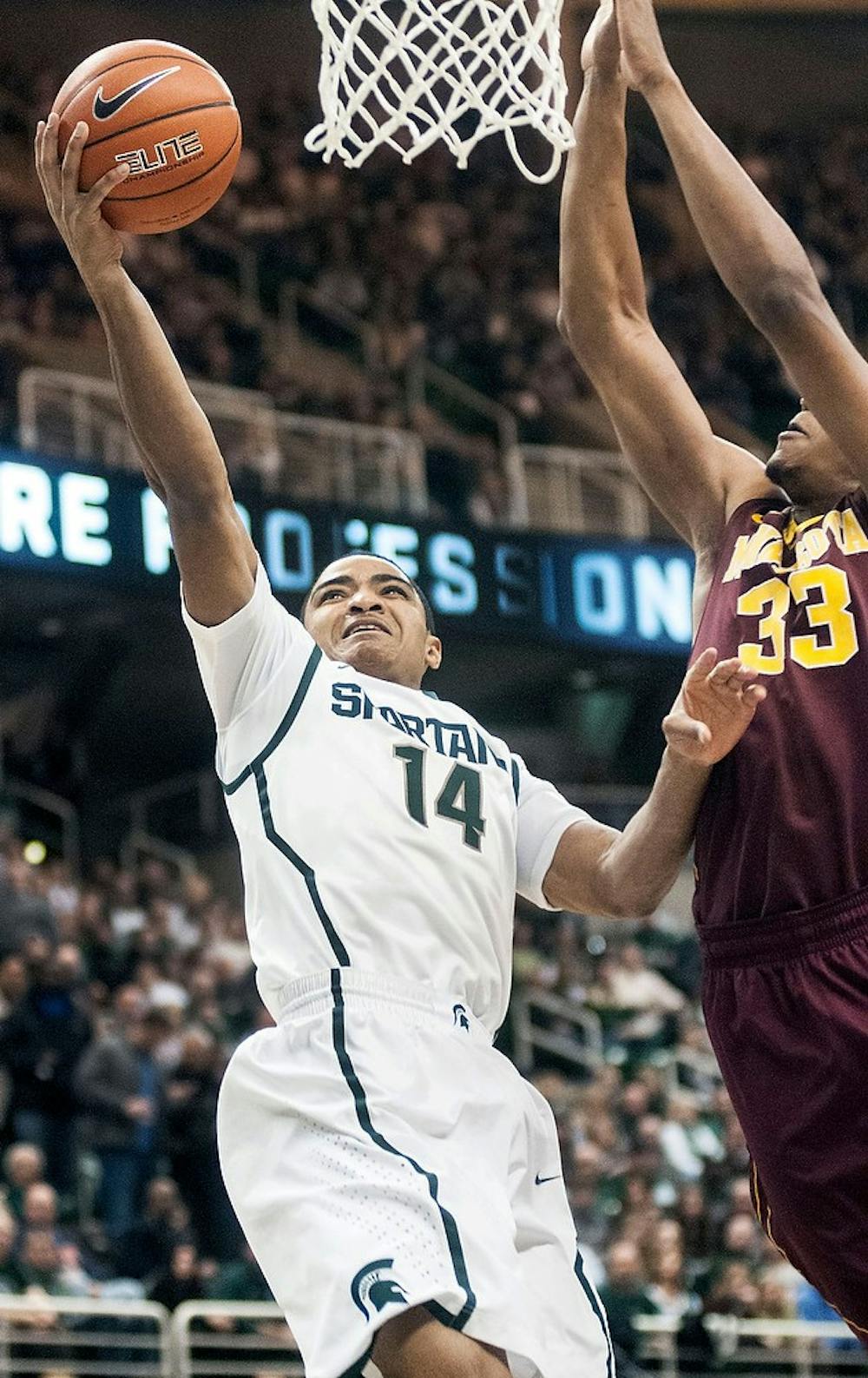 	<p>Freshman guard Gary Harris jumps for a layup Wednesday, Feb. 6, 2013, at Breslin Center. The Spartans defeated the Golden Gophers, 61-50, improving their record to 8-2 in the Big Ten. Adam Toolin/The State News</p>