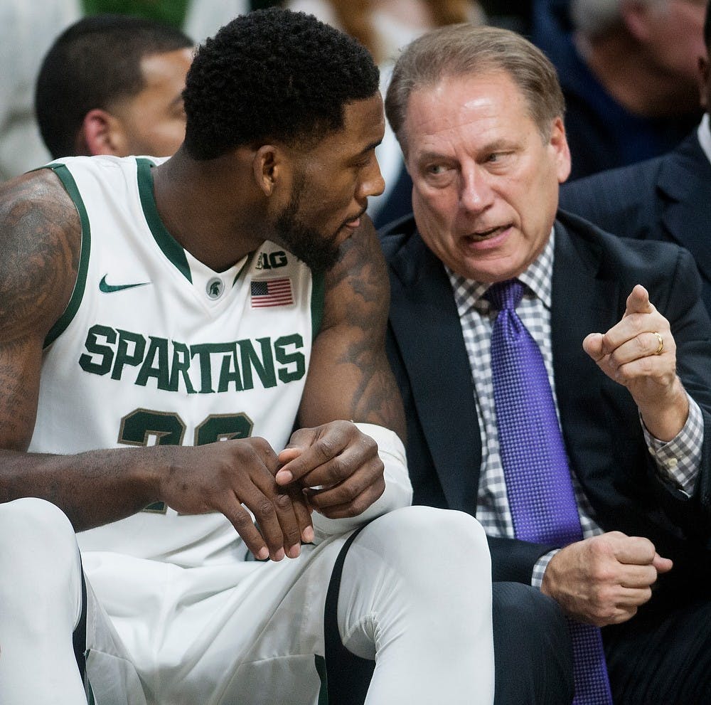 <p>Head Coach Tom Izzo talks with senior guard/forward Branden Dawson during the game against Arkansas-Pine Bluff on Dec. 6, 2014, at Breslin Center. The Spartans defeated the Golden Lions, 85-52. Aerika Williams/The State News </p>
