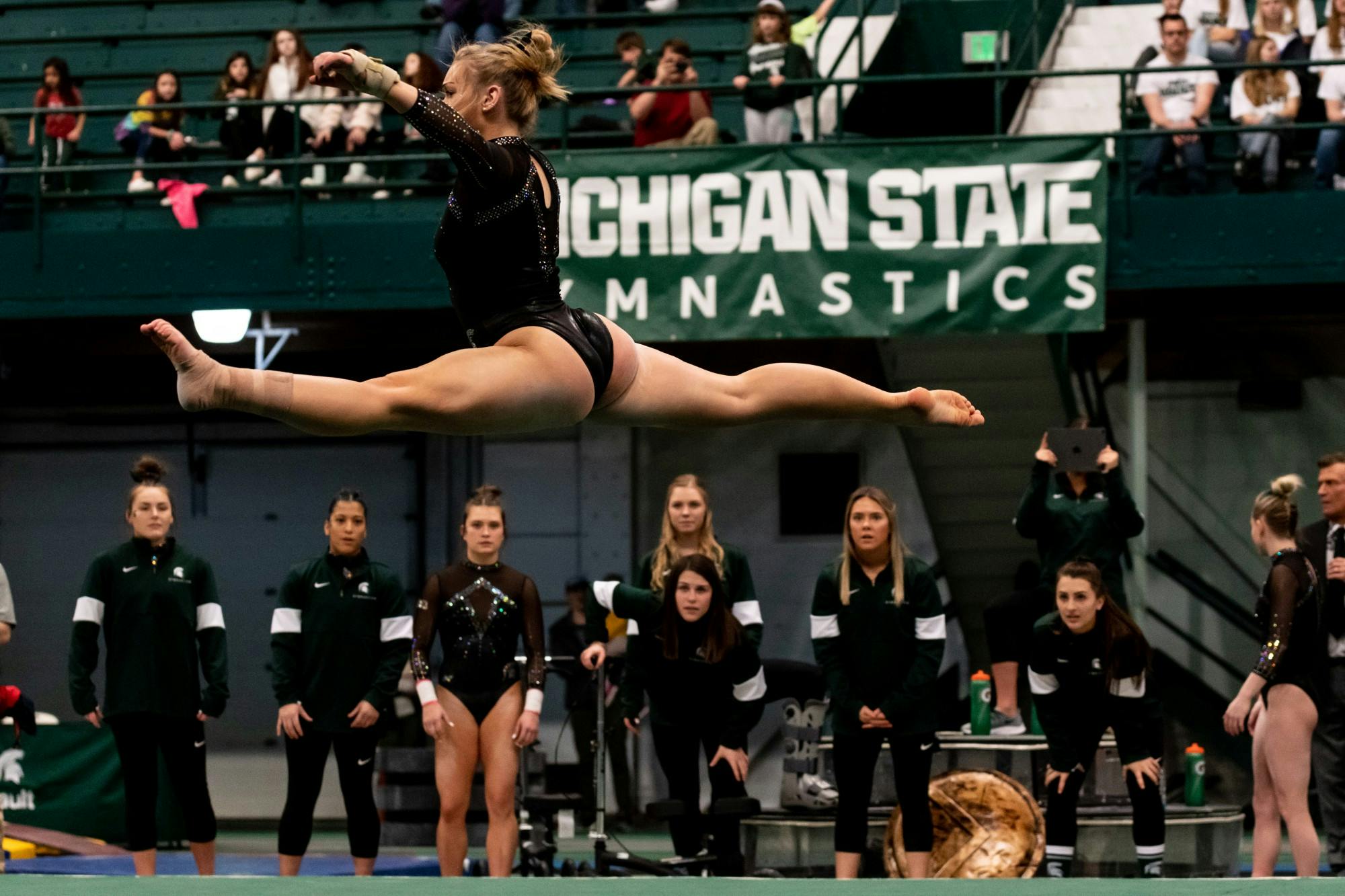 <p>Freshman Chloe Bellmore performs her floor routine during a meet against Nebraska. The Spartans fell to the Huskers, 196.550-197.100 on January 26 at Jenison Fieldhouse. </p>