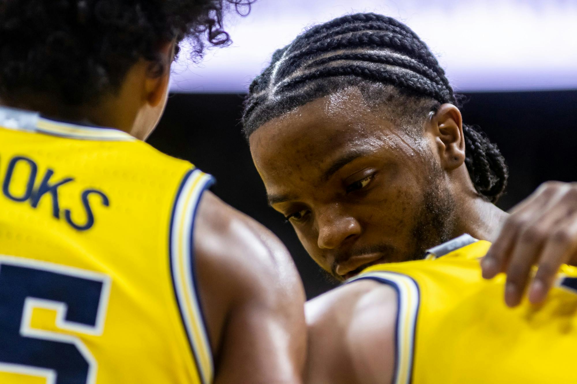 Michigan guard Zavier Simpson (right) talks to a teammate during a game against MSU.The Spartans defeated Michigan, 87-69, at the Breslin Student Events Center on January 5, 2020. 