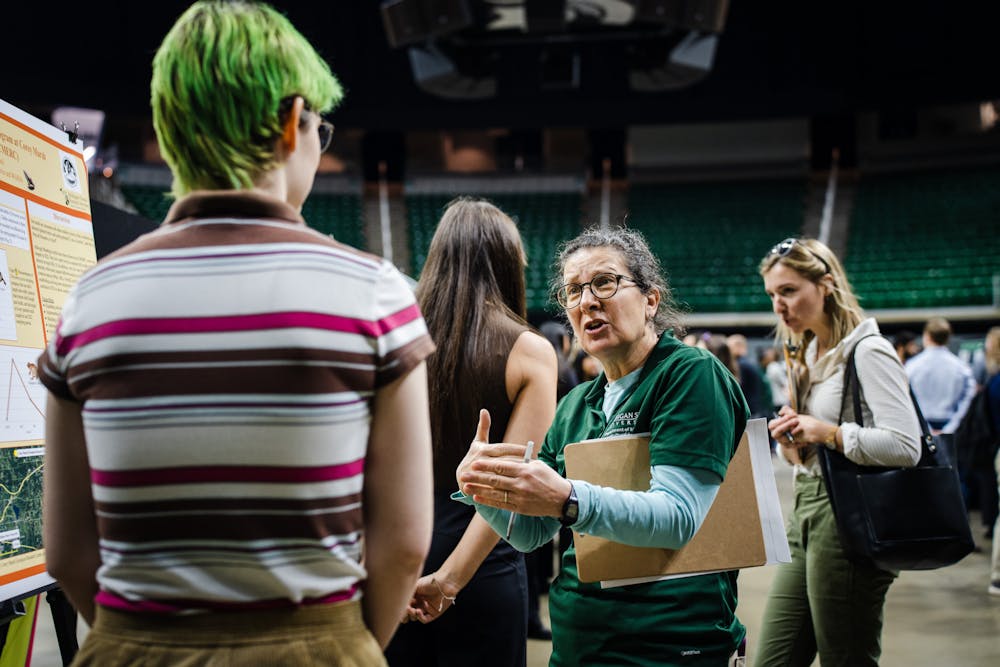 Student researchers gather and present at the URAF conference at the Breslin Center on Apr. 14, 2023.