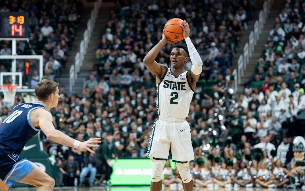 <p>Senior guard Tyson Walker (2) is about to pass the ball during the game against Villanova at the Breslin Center on Nov. 18, 2022. The Spartans defeated the Wildcats 73-71. </p>