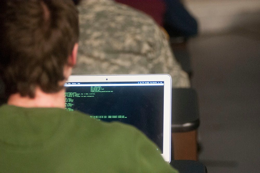 Computer science sophomore Keaton Coffman writes a code during a Spartan Hackers meeting on Feb. 9, 2016 at the Engineering Building. The club meets weekly to discuss and learn various computer science skills. 