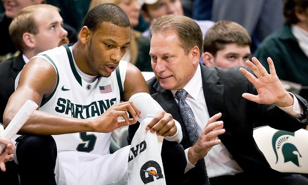 Then-sophomore center Adreian Payne listens to head coach Tom Izzo during the game on Nov. 20, 2011. The Spartans defeated the Trojans 69-47 Sunday night at Breslin Center.