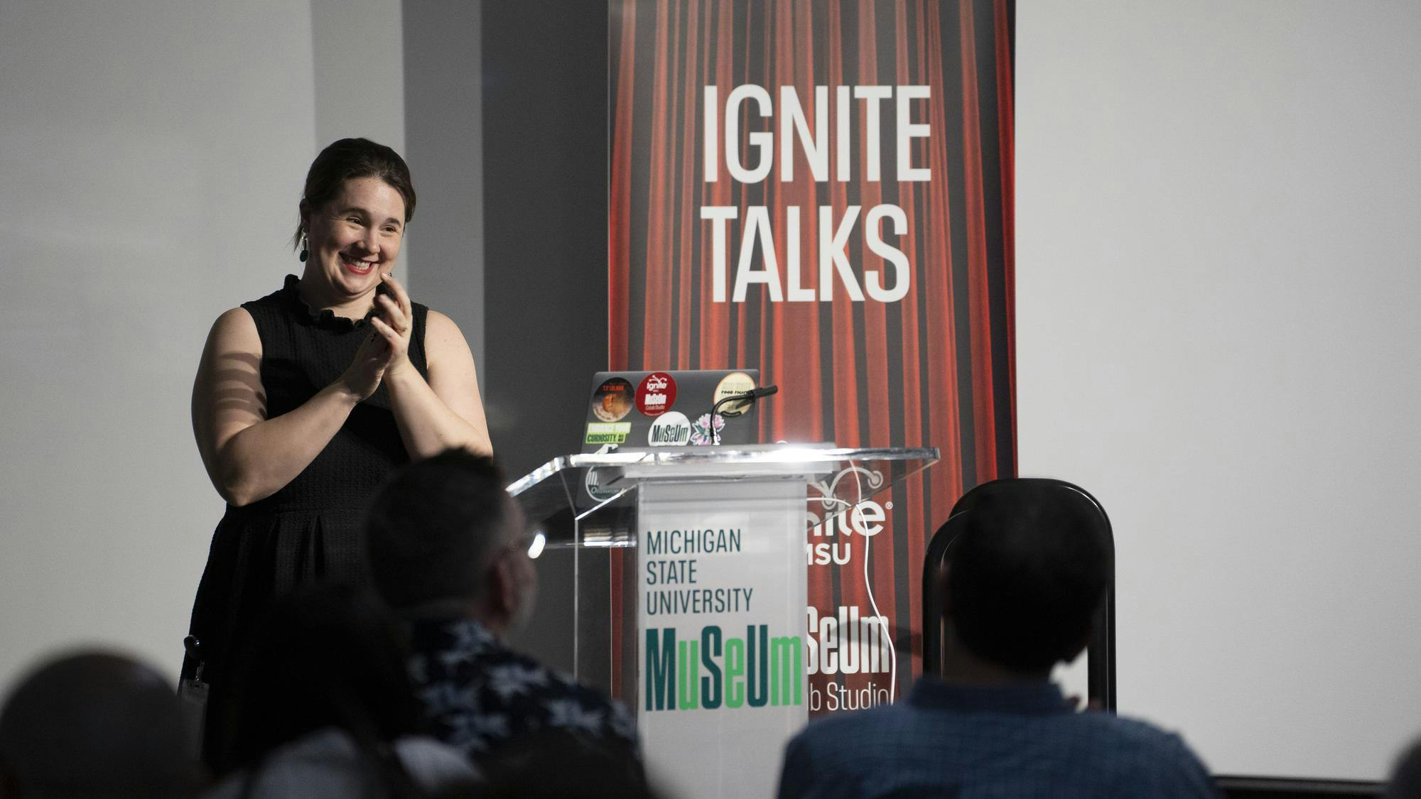 <p>Abbie Stevens, CoLab Studio Program Manager, applauds to the presenters during the intermission at Ignite Talks on Oct. 30, 2024.</p>