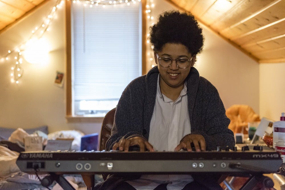 Jazz studies senior Dakota Peterson plays the piano on March 23, 2017 at her home in Lansing.