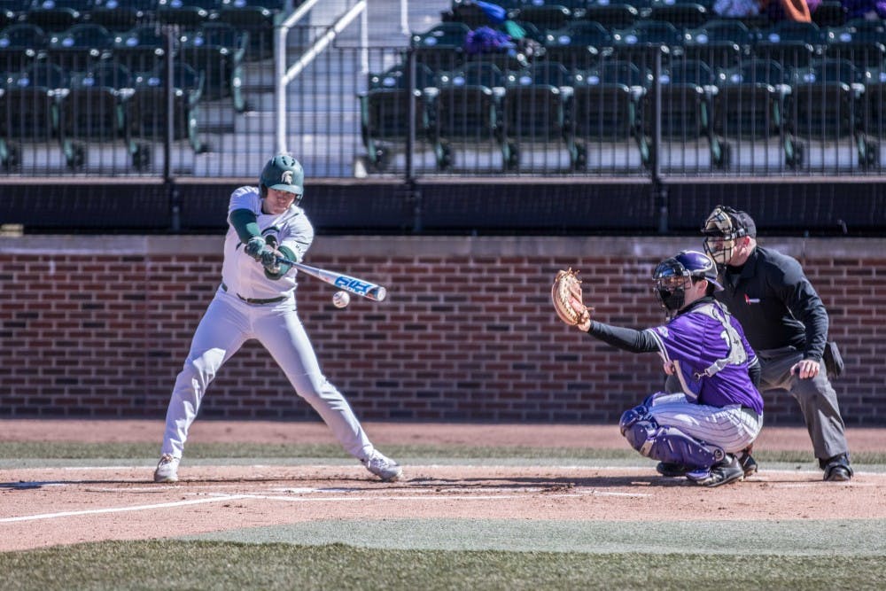 <p>Sophomore outfielder Bryce Kelley (17) puts a ball down the foul line during the game against Niagara on March 16, 2018 at McLane Baseball Stadium. The Spartans fell to the Purple Eagles, 3-2.</p>