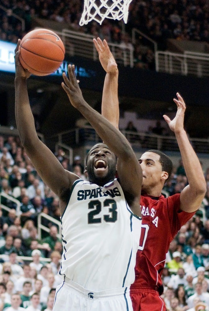 Senior forward Draymond Green beats Nebraska guard Toney McCray to the basket for two points. The Spartans defeated the Cornhuskers 62-34 Saturday night at Breslin Center. Anthony Thibodeau/The State News