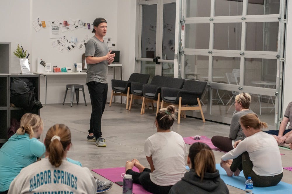 The Instructor guides students to relax with yoga during ASMSU Mental Health Awareness week at the Broad Art Lab on Nov. 12, 2018.