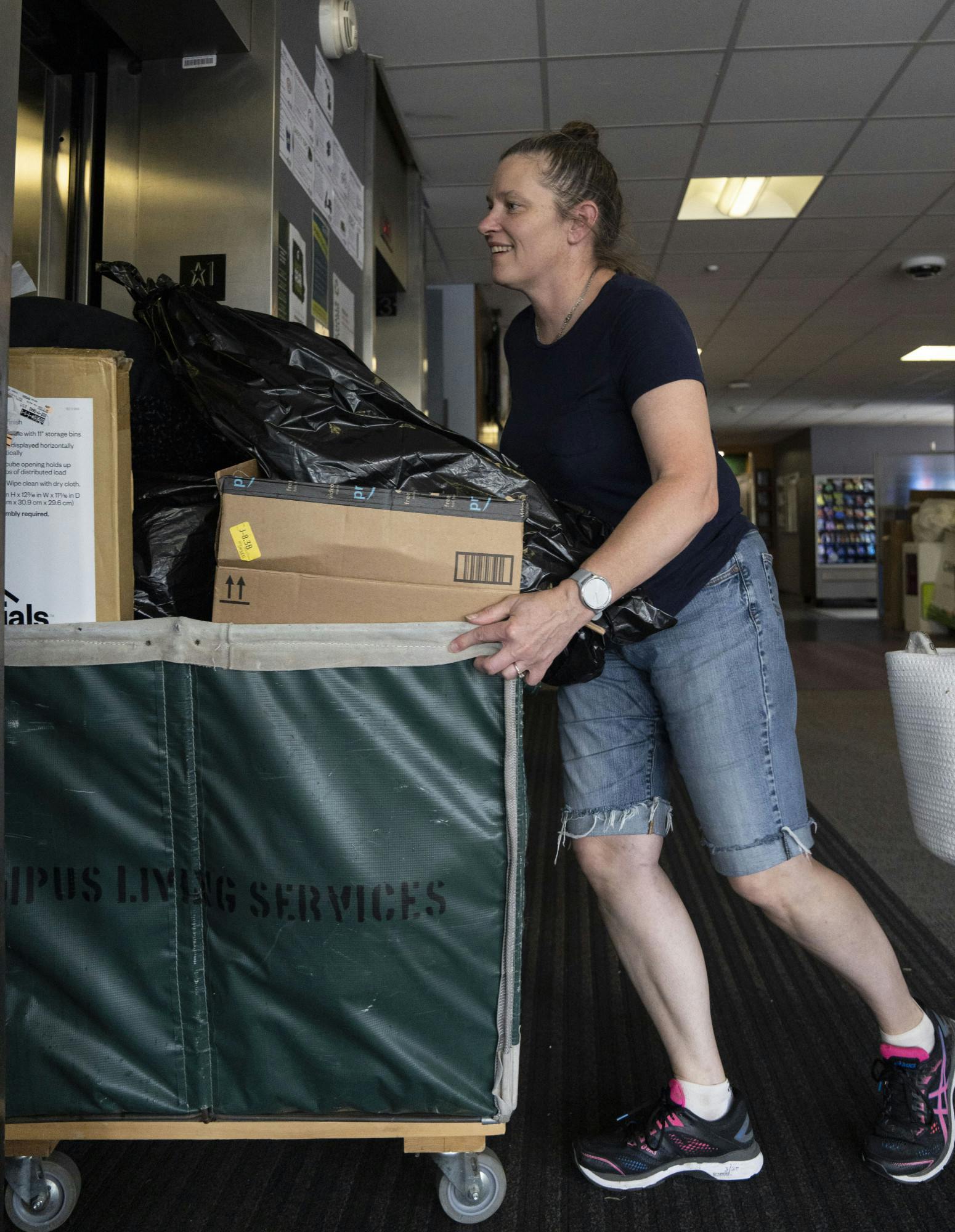 <p>Nina Medved moves in her daughter, Tierney Ordway, to Akers Hall during Fall 2022 Move-In on Thursday, Aug. 25, 2022 at Michigan State University.</p>