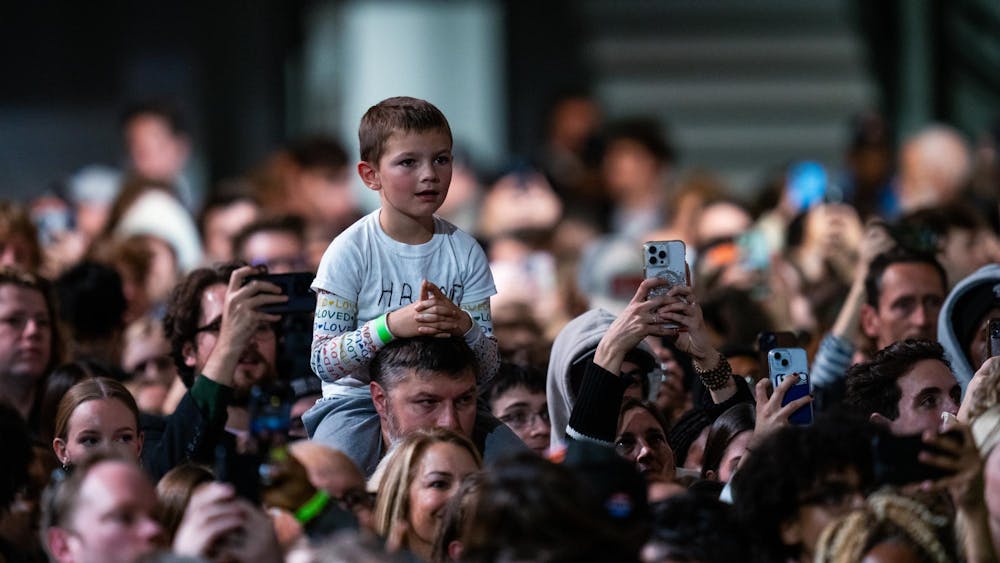 <p>A young member of the crowd listens to Vice President Kamala Harris speak at her presidential campaign rally on Michigan State University's campus in East Lansing, Michigan on Nov. 3, 2024. Vice President Harris' rally at MSU demonstrates this election cycle's focus on young voters and battleground states like Michigan.</p>