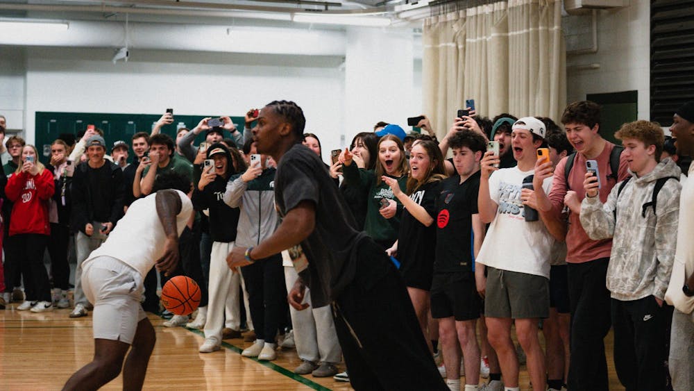 <p>Michigan State students react to a dunk from sophomore forward Coen Carr at IM East on April 16, 2025. The men's basketball team showed off their skills during pickup runs for students to watch.</p>