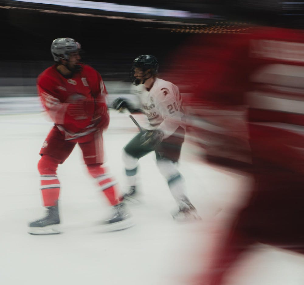 <p>MSU senior forward Daniel Russel (20) fights for the puck at the Munn Ice Arena in East Lansing, MI, on Feb. 27, 2026.</p>