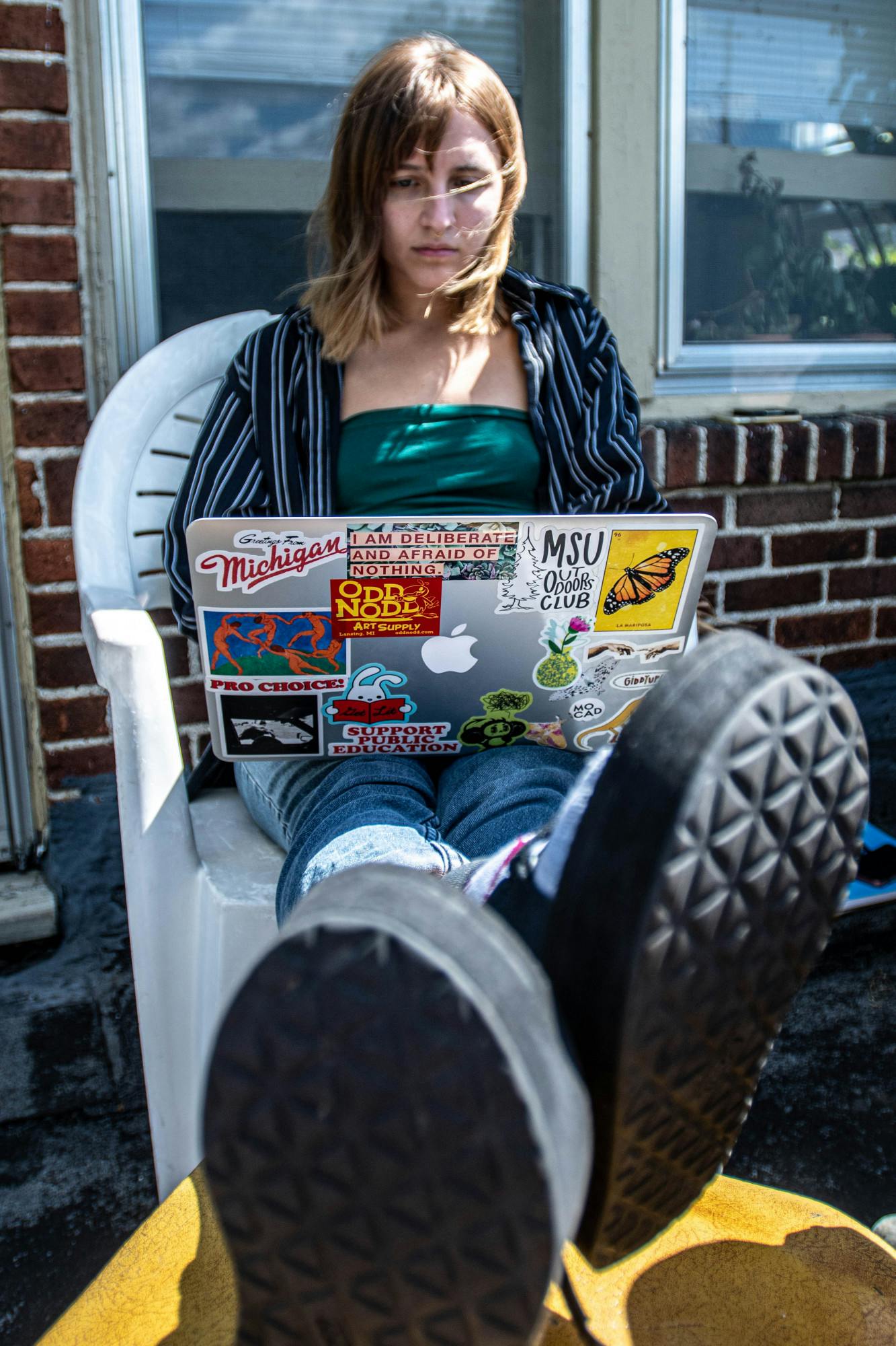 Education senior Emma Barnes studies on their balcony on Sept. 4, 2020.