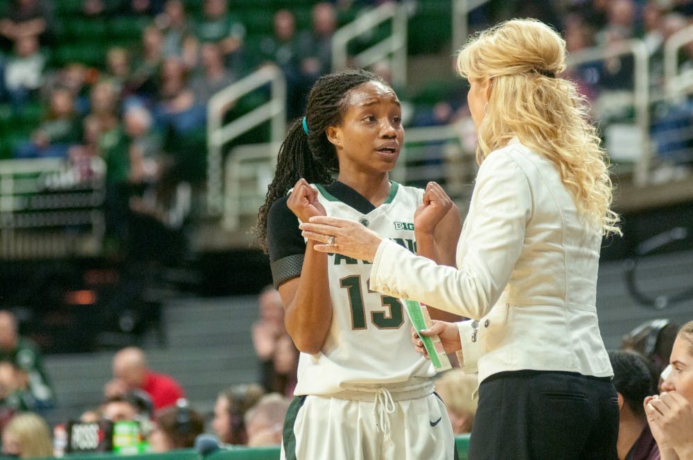 Sophomore guard Morgan Green talks to women's basketball head coach Suzy Merchant on Dec, 3, 2015 during the second half of the game against Louisville at Breslin Center. The Spartans were defeated by the Cardinals, 78-85. 