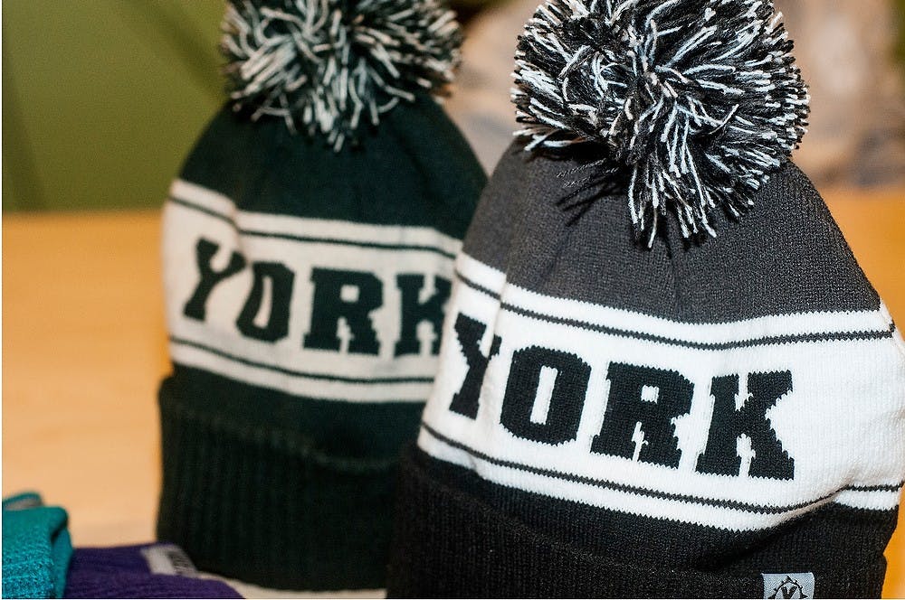 <p>Hats made by student entreprenuer and supply gain management junior Josh York sit on a table Oct. 7, 2014, as York shows his new designs to soon be released at The Hatch, 325 E. Grand River Ave. Suite 345 in East Lansing. For every item York sells, he donates one item to a homeless shelter.</p>