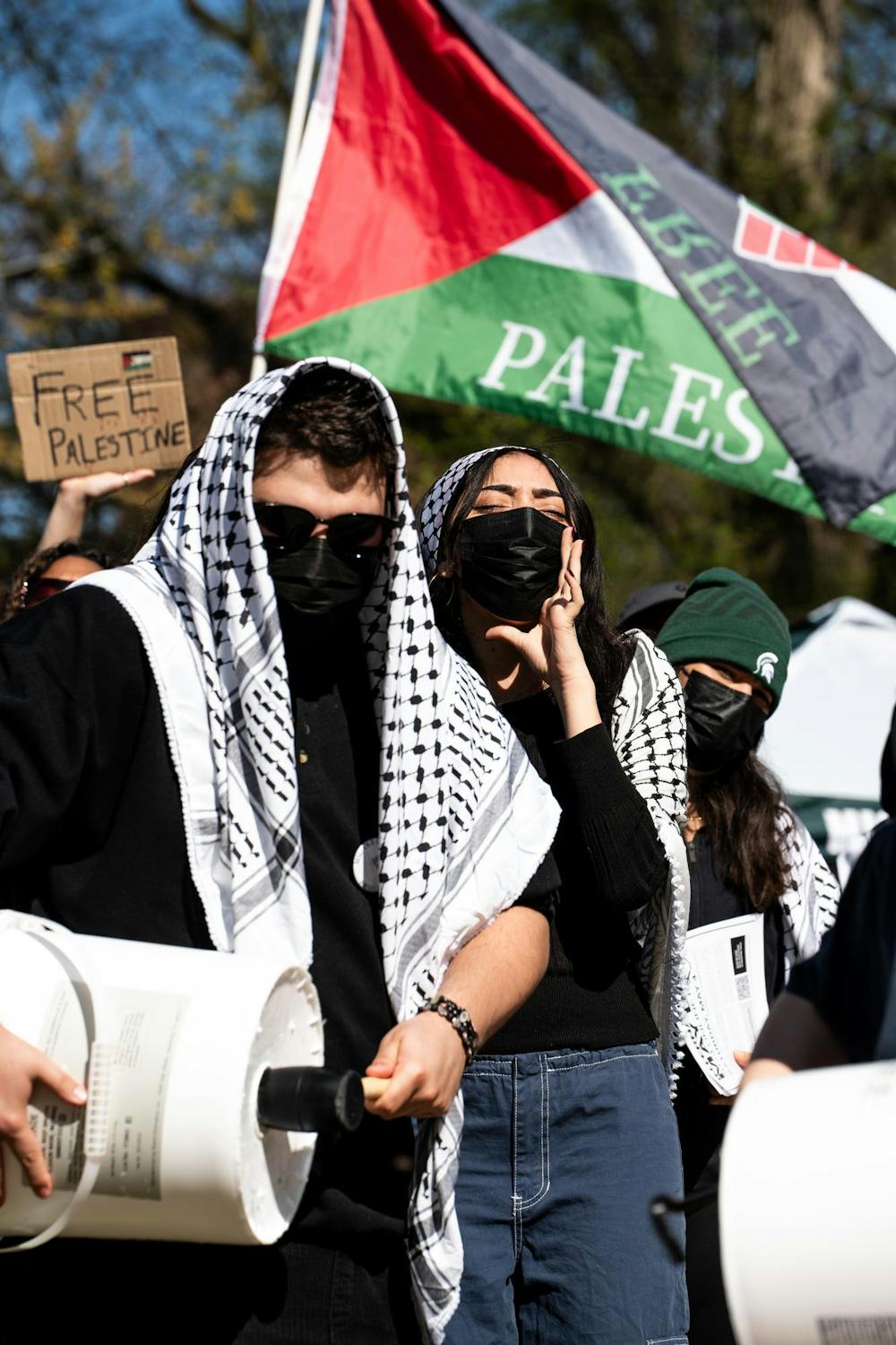Michigan State University students and community members yell chants at the Gaza solidarity encampment in People’s Park on MSU’s campus on April 25, 2024.