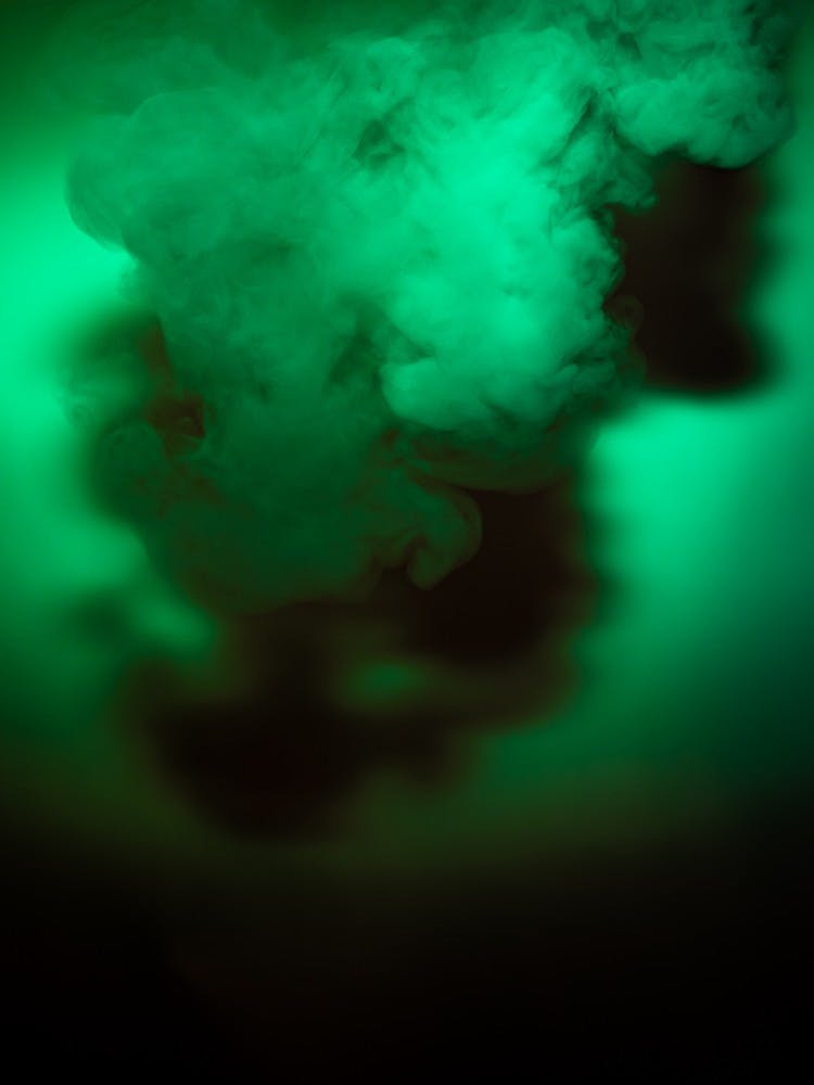 <p>A cloud of vapor underneath green light. Photographed on Oct. 21, 2019.</p>