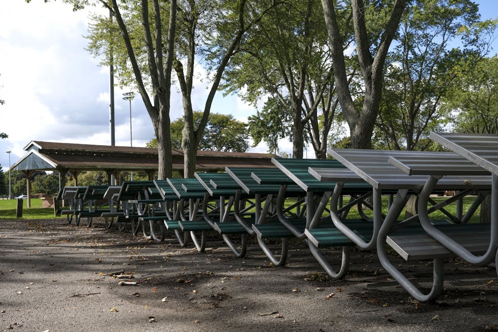 <p>Patriarche Park benches stacked up due to COVID-19 on September 29, 2020.</p>