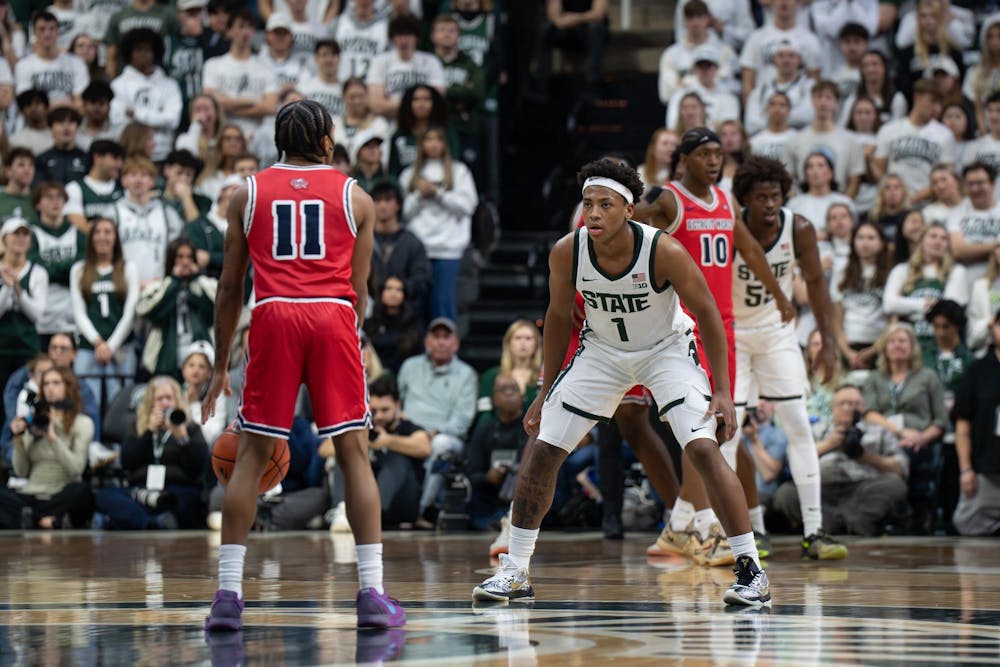 MSU guard Jeremy Fears Jr. (1) stares down Detroit Mercy guard Lance Stone (11) as he prepares his next pass during the Spartans’ matchup at the Breslin Center in East Lansing, Mich., on Friday, Nov. 21, 2025.