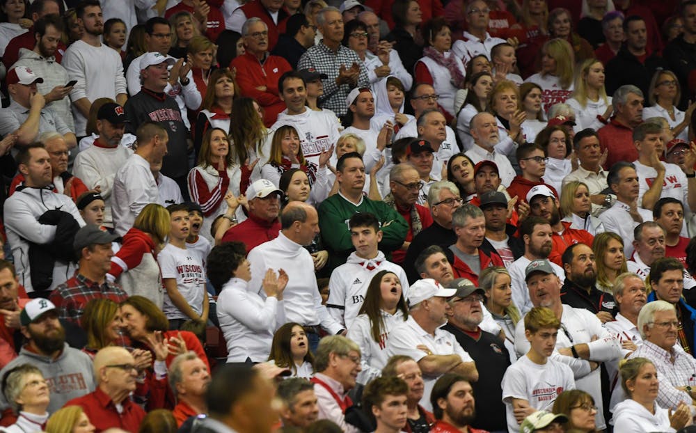 A lonely MSU fan sits among Wisconsin fans during the basketball game against Wisconsin at the Kohl Center in Madison, Wisconsin on February 1, 2020. The Spartans fell to the Badgers 63-64.
