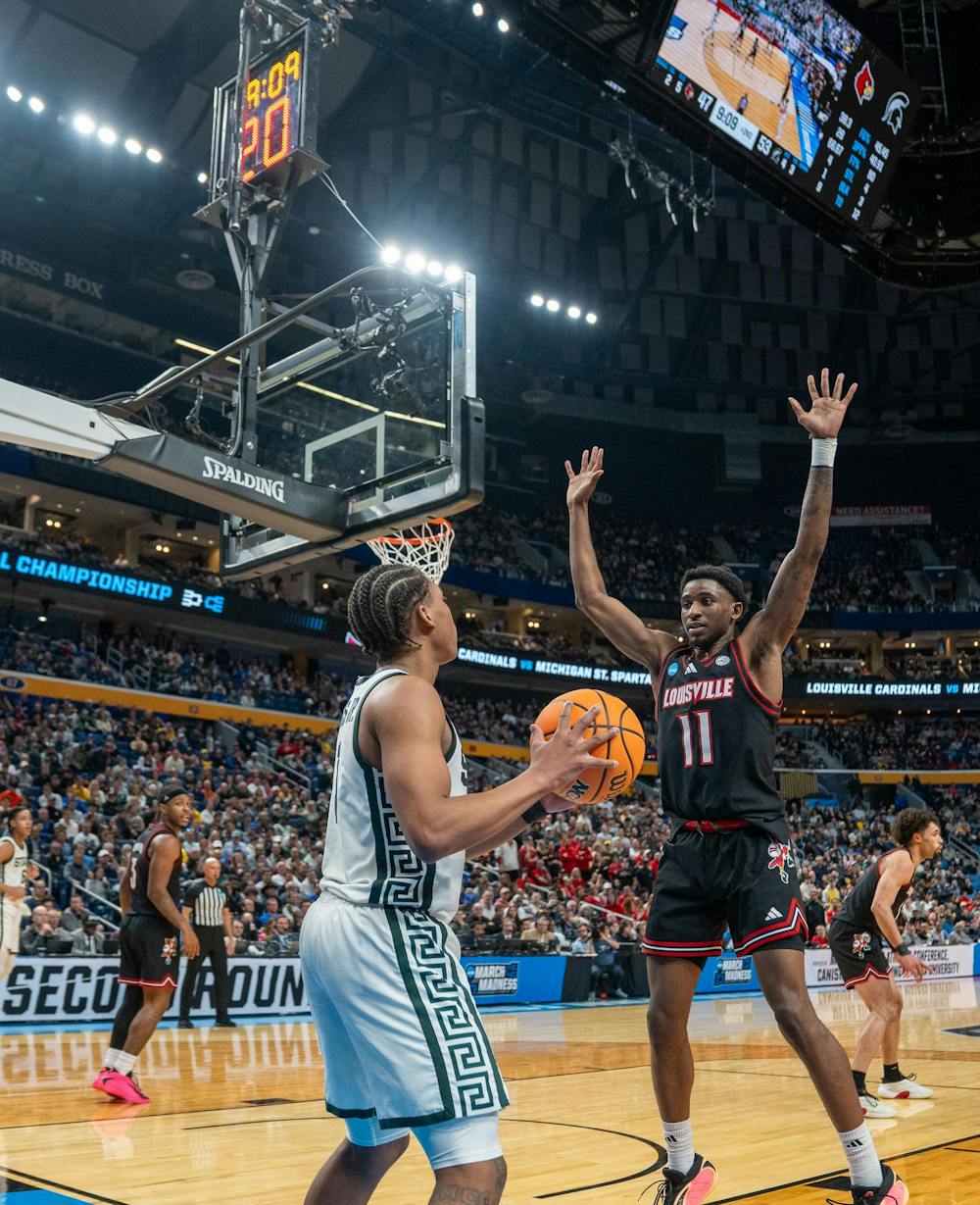 Redshirt Sophomore point guard Jeremy Fears Jr. (1) prepares to throw the ball in during the March Madness matchup against University of Louisville at the KeyBank Center in Buffalo, New York on March 21, 2026.