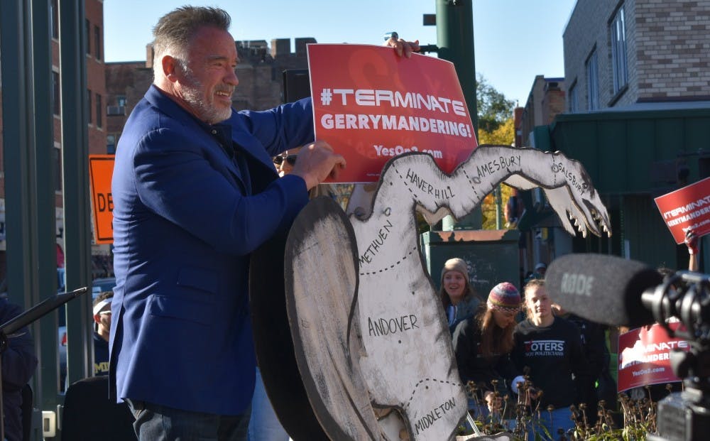 Former California Governor Arnold Schwarzenegger poses with a model of what is considered the first gerrymandered district in the United States on Oct. 20.