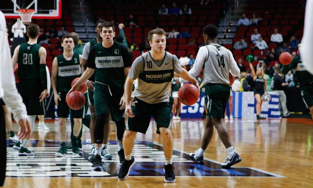 Michigan State runs drills during an open practice at Wells Fargo Arena March 20, 2019.