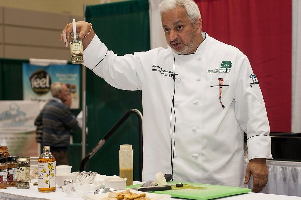 	<p>Executive Sous Chef Rajeev Patgaonkar does a cooking presentation during the sixth annual Making It In Michigan Conference and Premier Specialty Food Show on Nov. 12, 2013, at the Lansing Center. Patgaonkar created foods with ingredients that he chose from the show and plans on using some of them in dishes in the Kellogg Center kitchen. Margaux Forster/The State News</p>