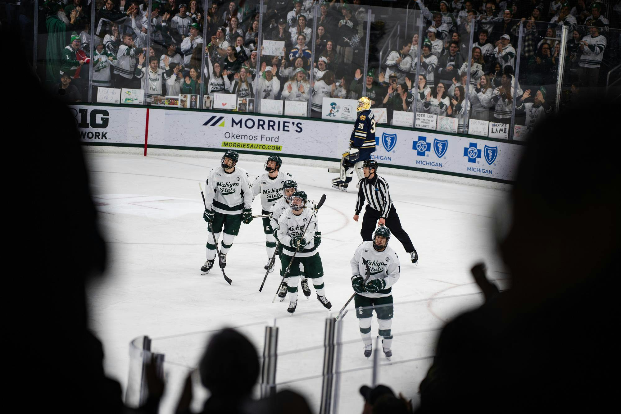 Michigan State hockey team looks toward the crowd after celebrating a goal during a game at Munn Ice Arena in East Lansing, Michigan, on Friday, Feb. 20, 2026.