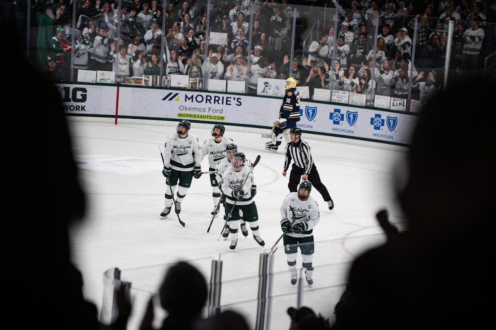 Michigan State hockey team looks toward the crowd after celebrating a goal during a game at Munn Ice Arena in East Lansing, Michigan, on Friday, Feb. 20, 2026.