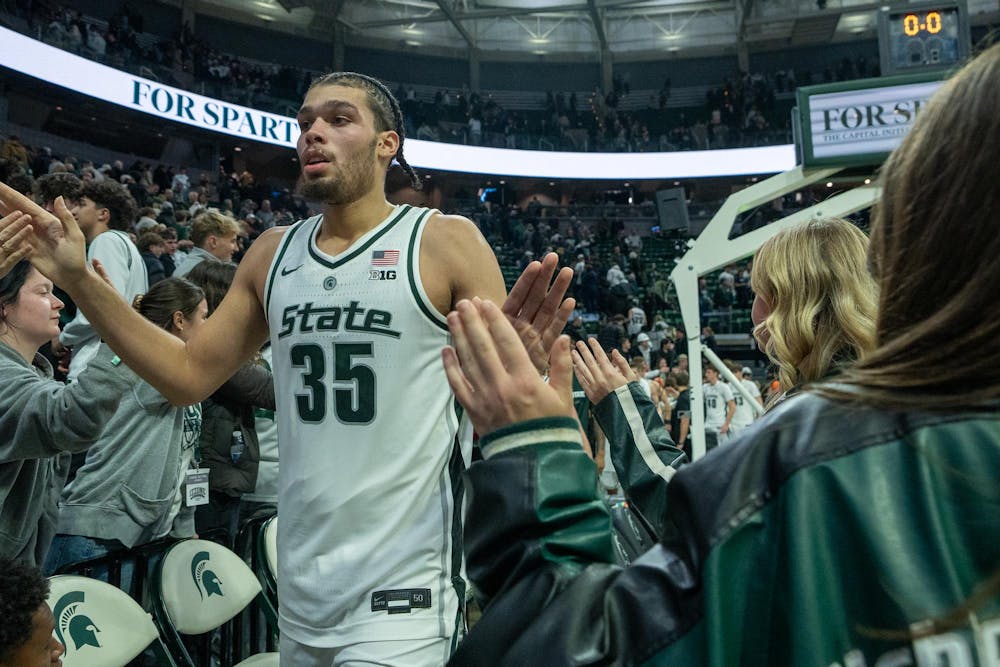 <p>Freshman forward Jesse McCulloch (35) high-fives fans after MSU’s victory over the University of Iowa at the Breslin Center on Dec. 2, 2025.</p>