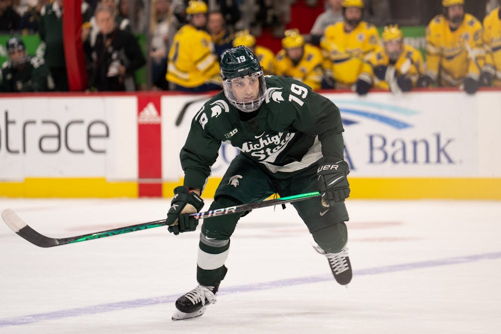 <p>Senior forward Nicolas M<span style="color: rgb(32, 33, 36);">ü</span>ller (19) focuses in during the first period of the Duel in the D at Little Caesars Arena on Feb. 11, 2023. The Spartans fell to the Wolverines with a score of 4-3.</p>