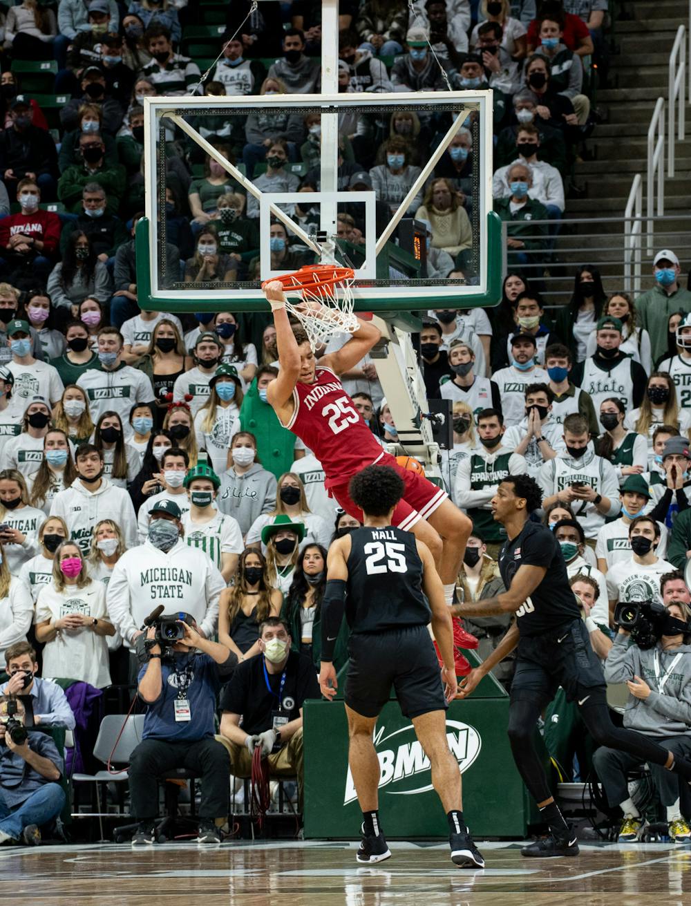 <p>Indiana&#x27;s redshirt senior forward Race Thompson (25) hangs onto the rim after dunking during Michigan State&#x27;s victory over Indiana on Feb. 12, 2022.</p>