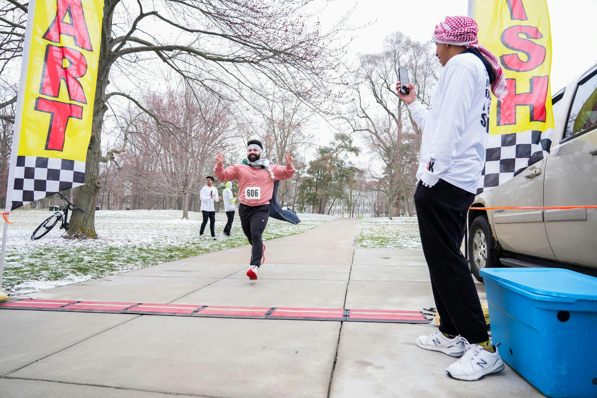 Abe Atwa crosses the finish line at the "Race for Humanity" 5k on MSU's campus on Sunday, March 10, 2024. The race was organized by Students United for Palestinian Rights and Arab Culture Society in support of Palestinian refugees.