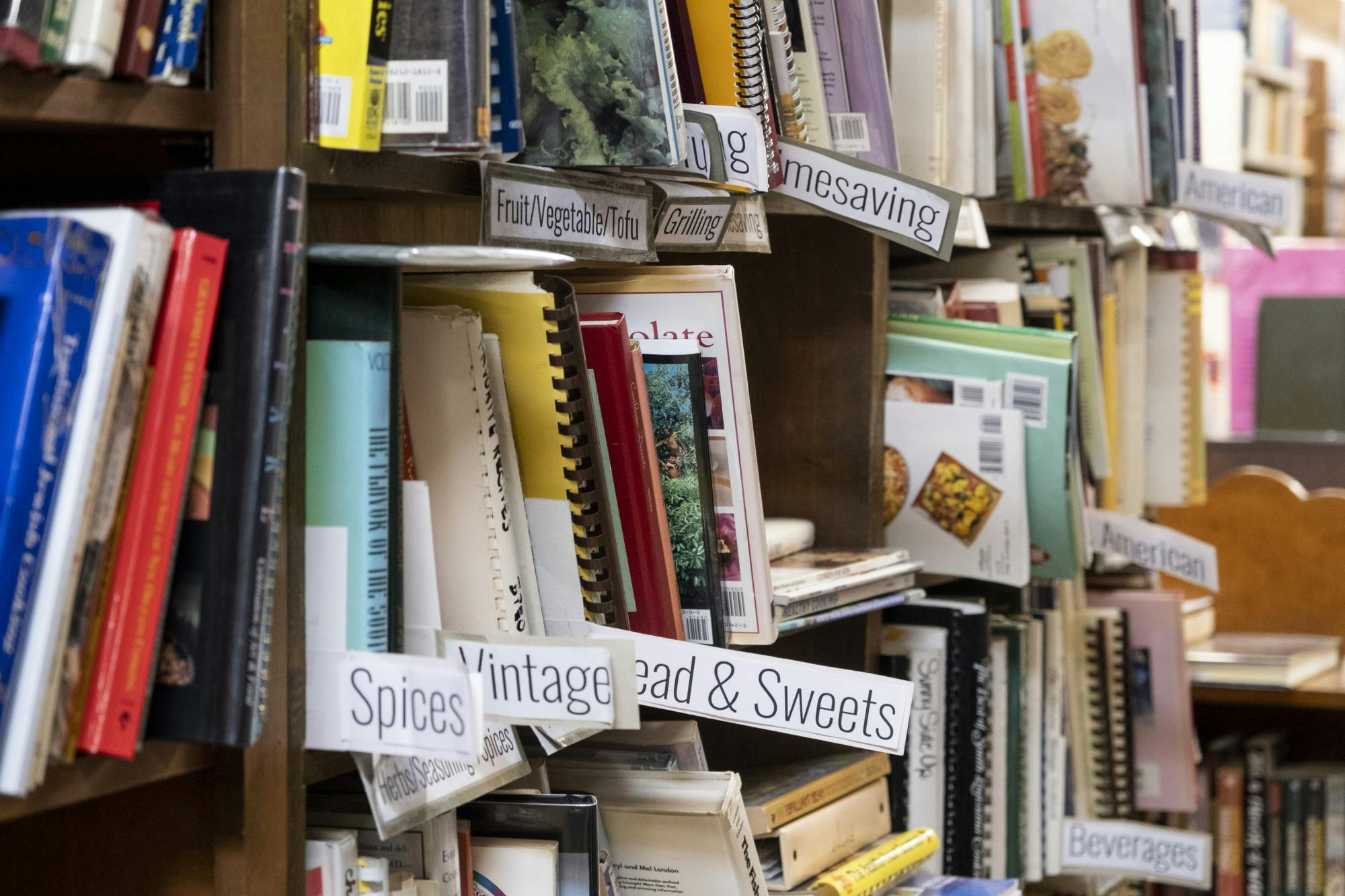 Labeled shelves of the cookbook section of the Curious Book Store on Sept. 1, 2021.