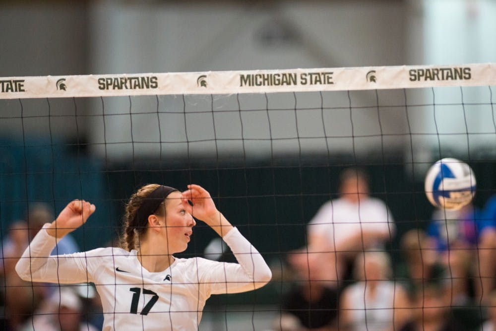 Junior middle blocker Alyssa Garvelink (17) fails to make contact with the volleyball during the volleyball game against the University of Florida on Sept. 4, 2016 at Jenison Field House. The Spartans were defeated by the Gators, 3-0.