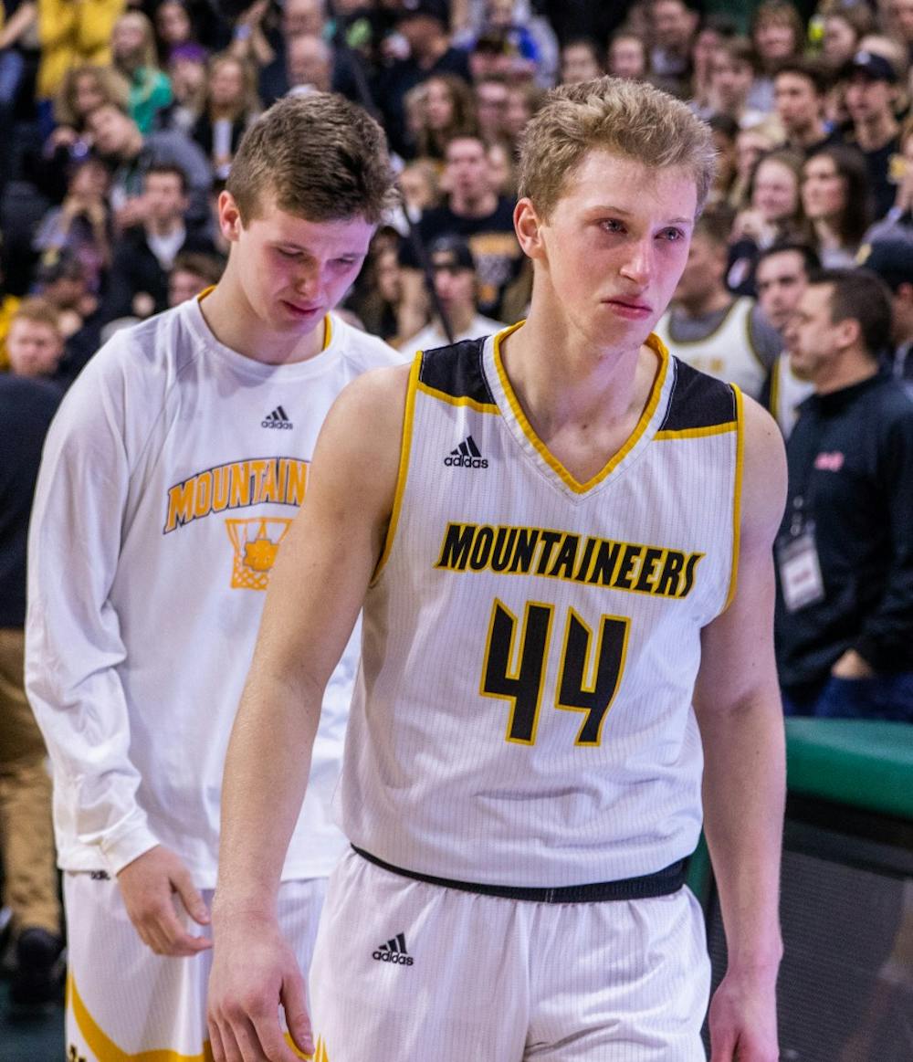 Senior forward Charlie Gerhard walks to shake the hands of the Pewamo-Westphalia Pirates following their game March 16, 2019, at Breslin Center. The Pewamo-Westphalia Pirates defeated the Iron Mountain Mountaineers, 53-52.