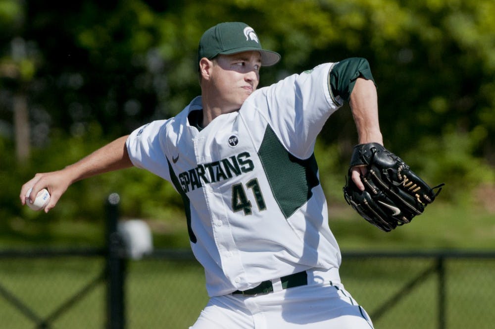 Senior right hand pitcher Tony Bucciferro delivers a pitch on May 11, 2012 at McLane Baseball Stadium at Old College Field during a game against Iowa. Justin Wan/The State News