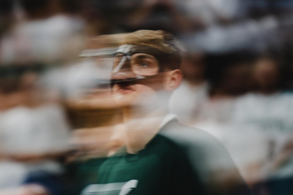 <p>MSU junior center Carson Cooper (15) warms up before MSU takes on Bowling Green at the Breslin center on Nov. 16, 2024</p>