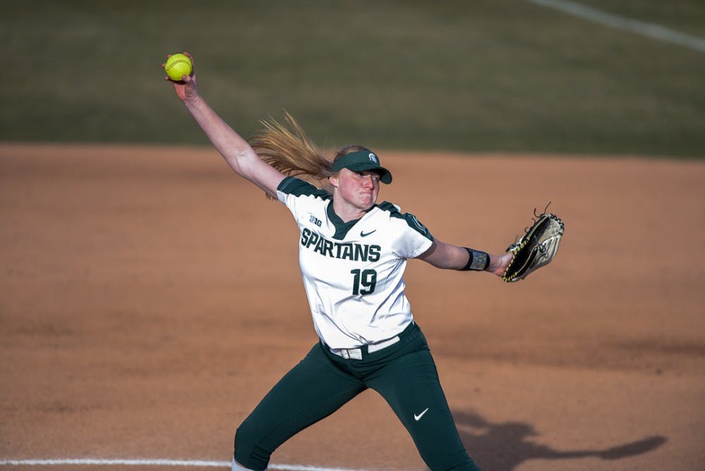 <p>Sophomore pitcher Alli Walker (19) winds up during the game against Oakland on April 3, 2019 at Secchia Stadium. The Spartans beat the Golden Grizzlies, 11-3.</p>