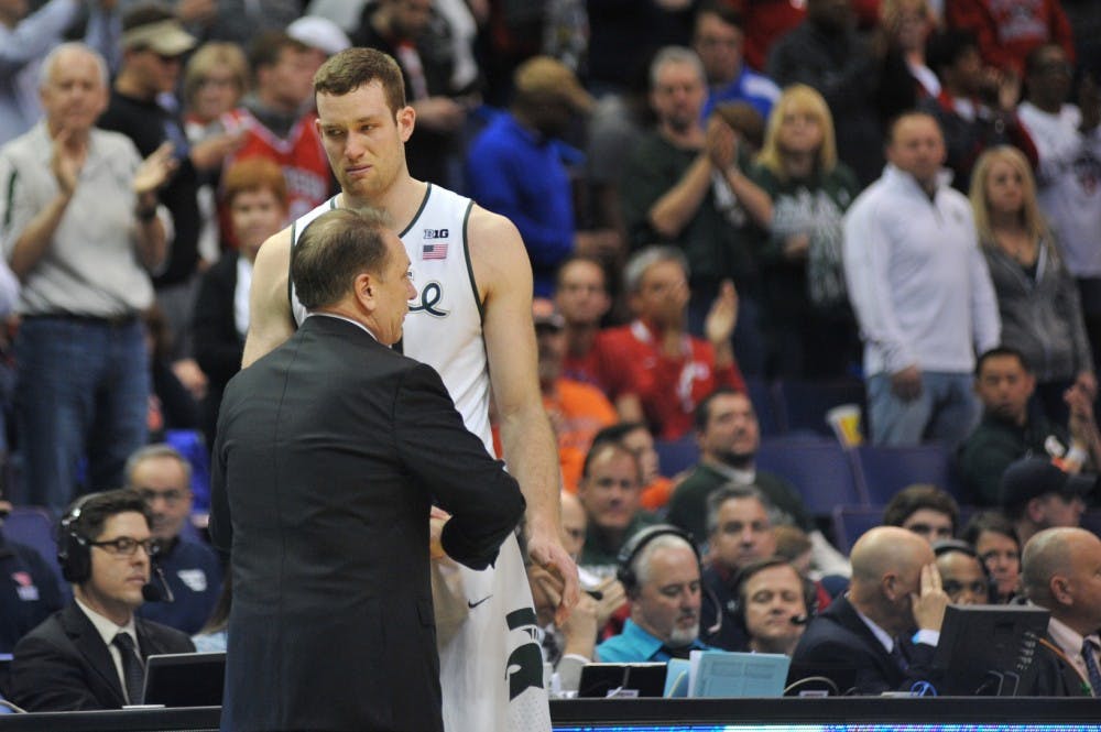 Head coach Tom Izzo talks to senior forward Matt Costello  during the game against Middle Tennessee State University on March 18, 2016 at Scottrade Center in St. Louis, Mo. The Spartans were defeated by the Raiders, 90-81.