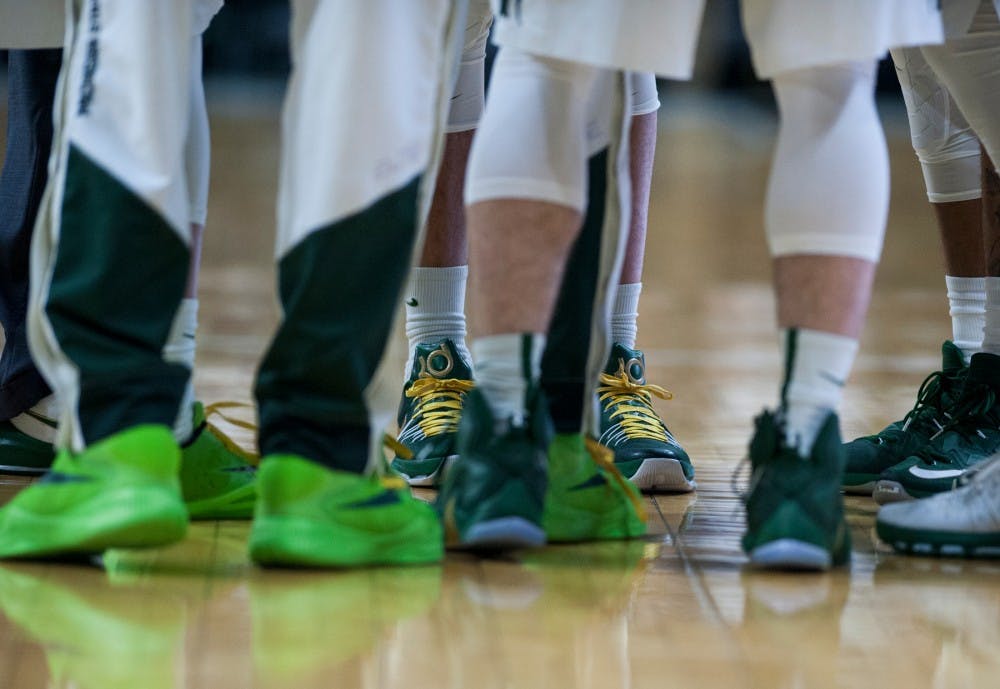 Senior forward Denzel Valentine wears gold laces prior to the game against Rutgers on Jan. 31, 2016 at Breslin Center. The Spartans wore the shoelaces in honor of the late Princess Lacey.